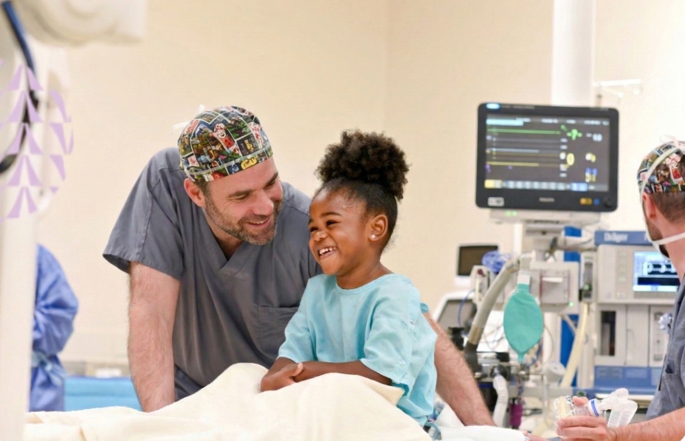 Dr. Bellig with smiling girl